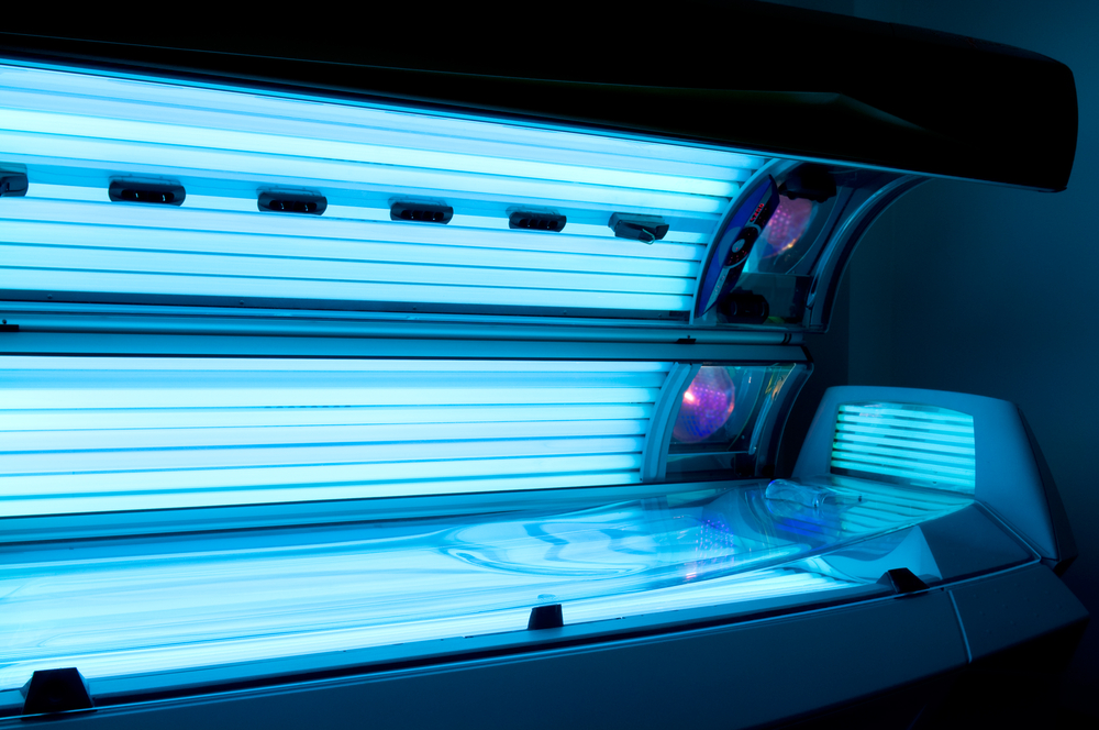 A picture of a sleek and modern stand up tanning bed perfect for home use.